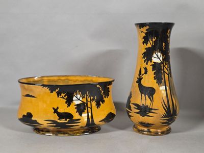 two vases sitting next to each other on a table