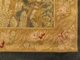a picture of a tapestry with a picture of a man riding a horse