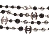 a close up of a rosary with a cross on it