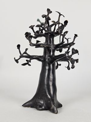 sculpture of a tree with birds perched on it on a white background