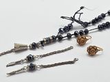 a bunch of jewelry that is laying on a table