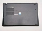 a black laptop with a blue sticker on it