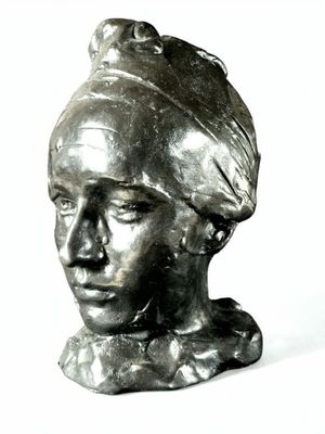 a statue of a woman with a turban on her head