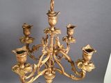 a gold colored candelab with a bunch of candles on it