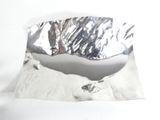 a piece of aluminum foil on top of a piece of paper