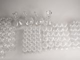 a lot of empty wine glasses on a white surface