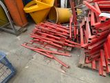 a pile of red metal items on the ground