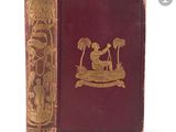 an old book with a gold design on the cover of it