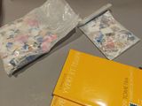 a box of stamps sitting on a table next to a package of stamps