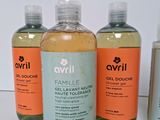 three bottles of avrill are sitting next to each other