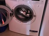 a washer and a dryer in a small room