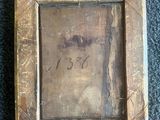 an old picture of a picture frame on a blue carpet