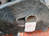 a roll of carpet that has been rolled up on a shelf
