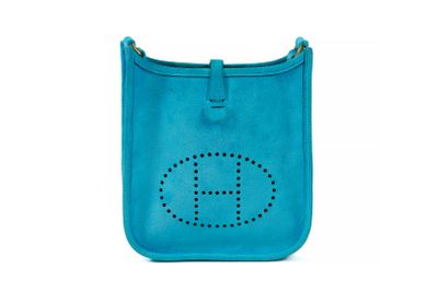 a blue purse with the letter h on it