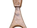 an image of a bottle opener with a face on it