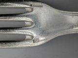 a close up of a fork and a knife on a table