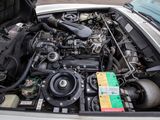 a car engine with its hood open in the back of the car