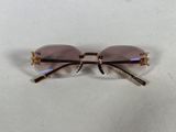 a close up of a pair of glasses on a white surface