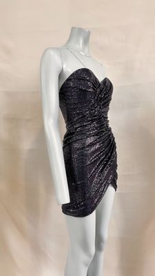 the mannequin is wearing a black dress on a white mannequin