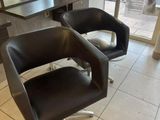 two chairs that are sitting in front of a table