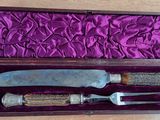 a knife and a knife holder in a purple box