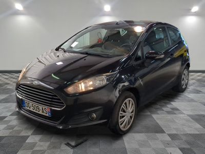 a picture of a black ford fiesta parked on a checkered floor