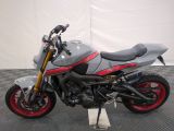 a picture of a motorcycle parked on a checkered floor
