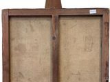 an old wooden easel with a piece of burlock on top of it