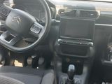 a picture of a car with a steering wheel and dashboard