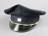 a black hat with blue writing on it sitting on a table
