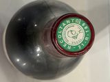 a close up of a bottle of wine on a table