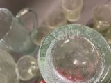 a person holding a glass with a lot of liquid in it