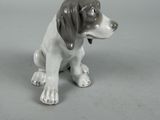 a figurine of a dog sitting on a table