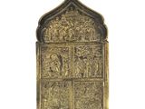an old brass door with a window and a cross on it