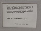 a plaque on the wall of a building that has a picture on it