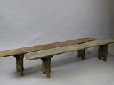 two wooden benches sitting next to each other on a white background
