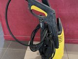 yellow and black high pressure cleaner on tiled floor in kitchen