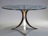 an image of a glass table with a metal base and a glass top