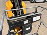 a forklift with a fork on it in a parking lot