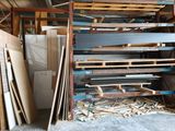 a large amount of wood and metal in a warehouse