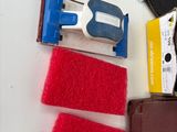 the contents of a leather wallet are laid out on a table