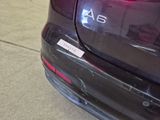 a close up of the rear end of a car with a sticker on it