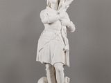 statue of a woman holding a flag on a pedestal