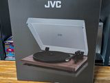 an open box of a record player sitting on top of a wooden table