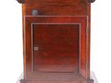 a small wooden cabinet with a door and a drawer