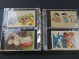 four cards in a binder on a table
