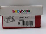 a box with a pair of baby shoes in it