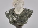 marble bust of a man wearing a shawl on top of a pedestal