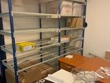 a room with a lot of shelves and boxes on it