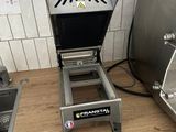 a toaster and a toaster on a counter in a kitchen